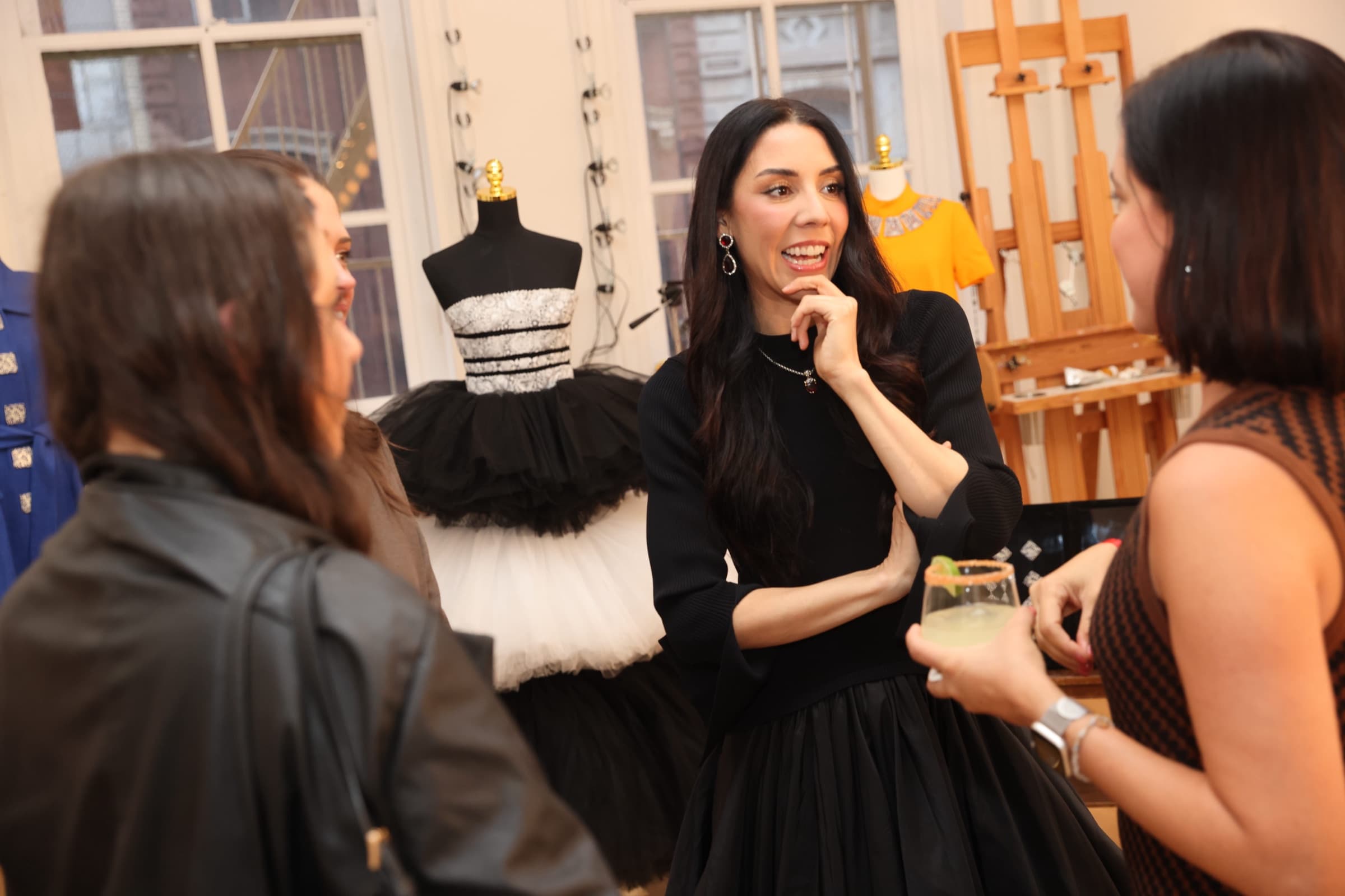Guests conversing by the fashion display