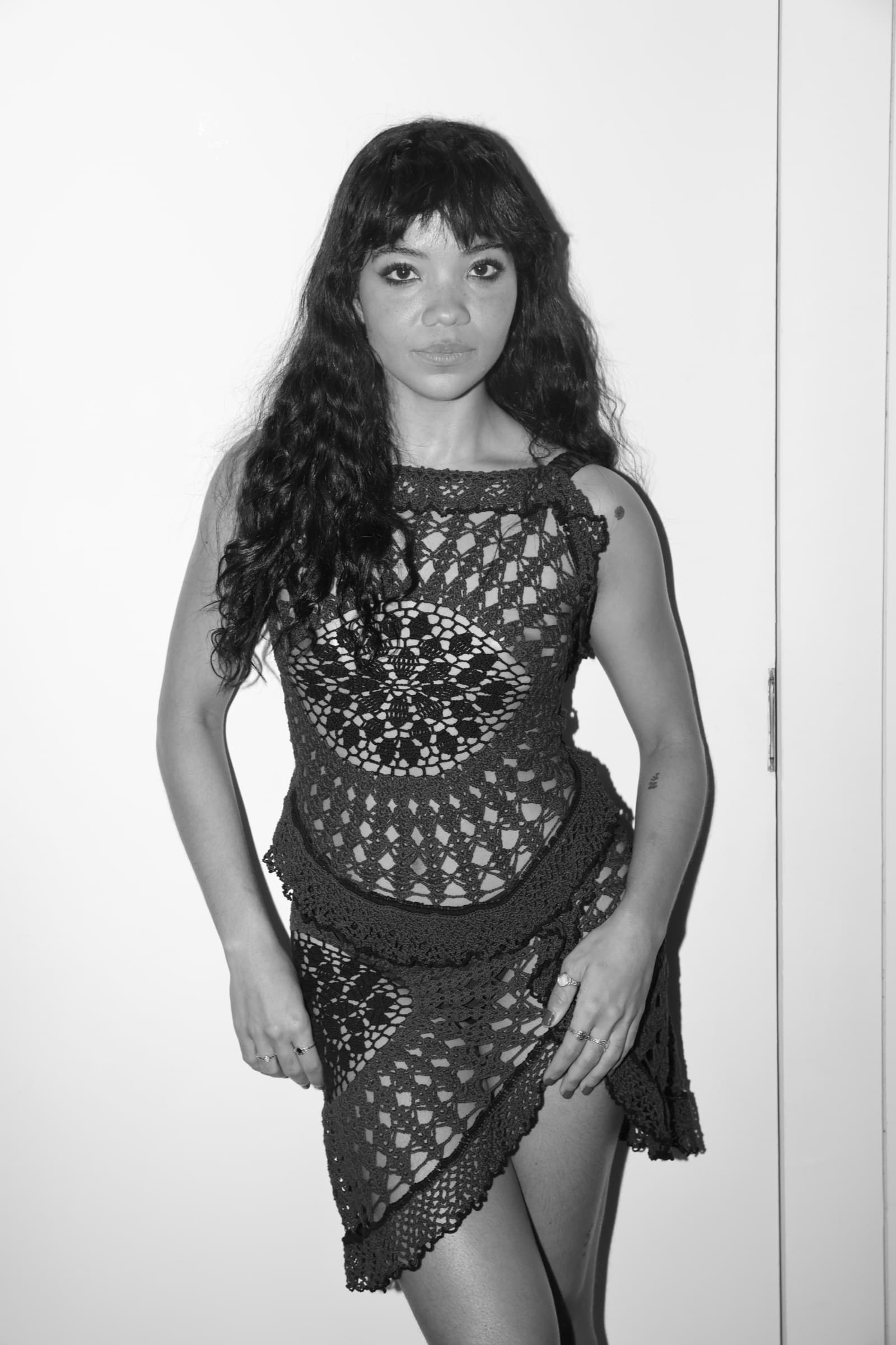 Portrait in mesh dress, black and white