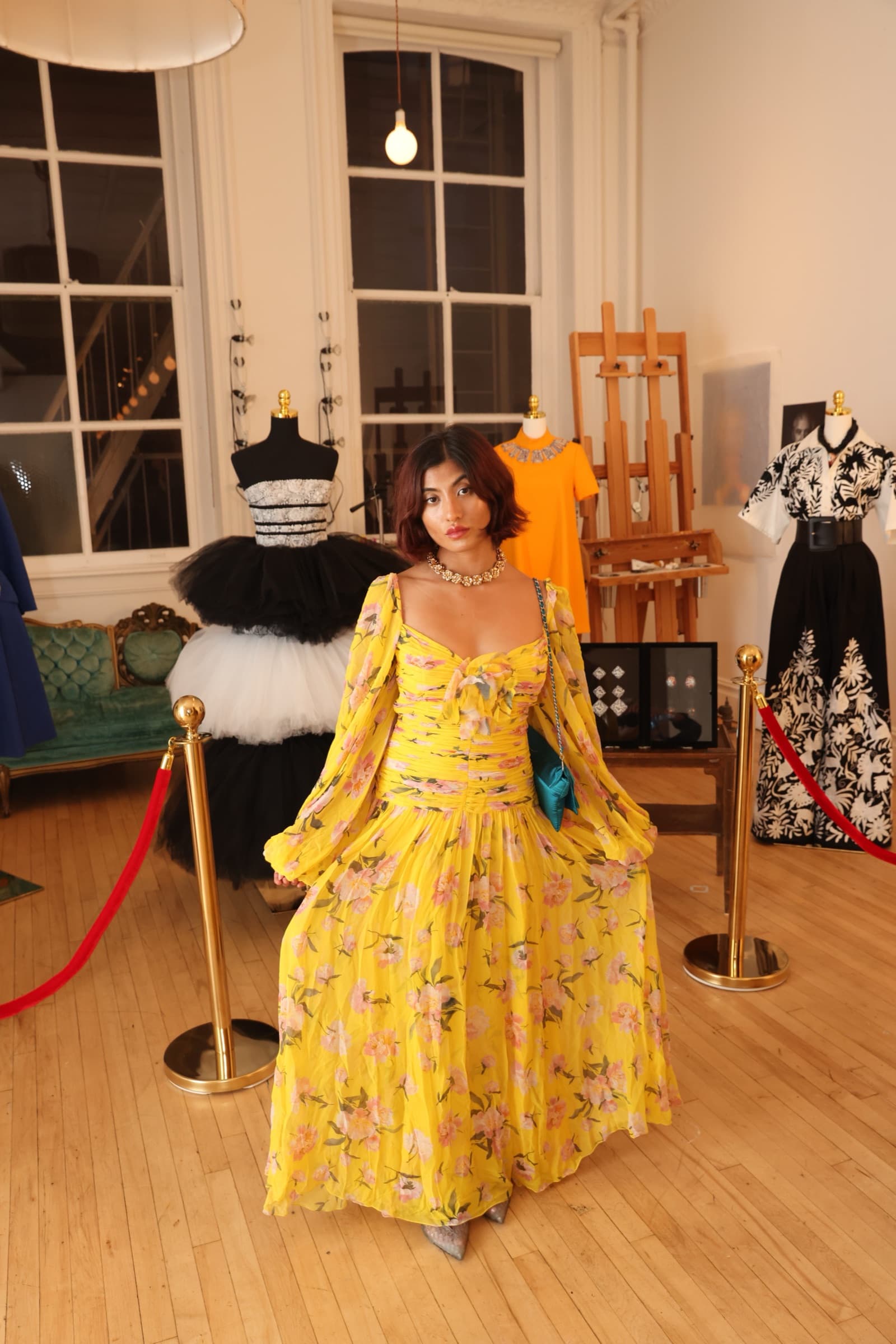Guest in yellow lace dress, seated
