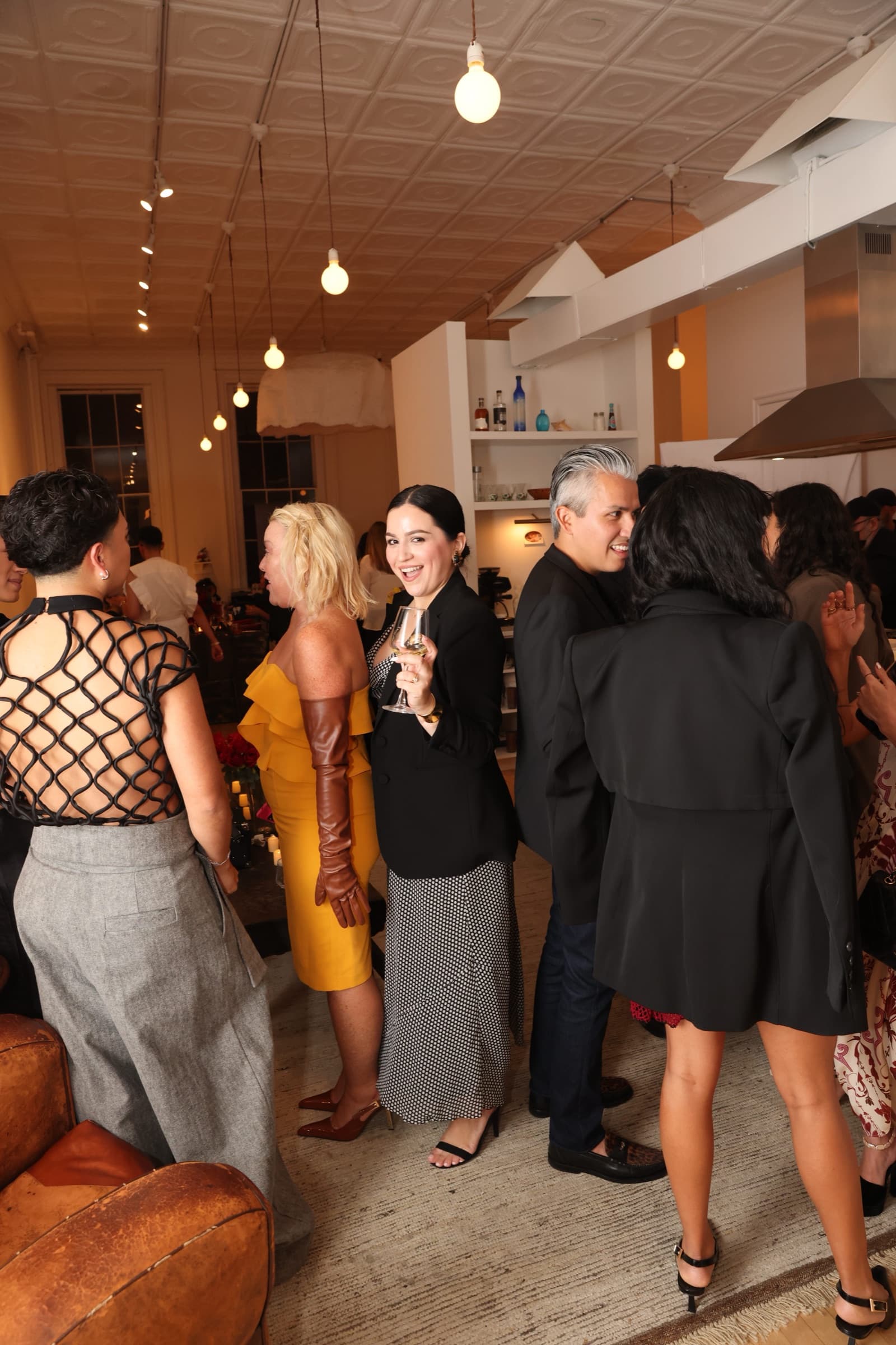 Guests mingling under cafe lights